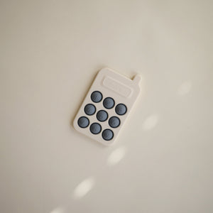 Colorful phone press toy for babies, promoting sensory play and fine motor skills development. Angle 7 view.