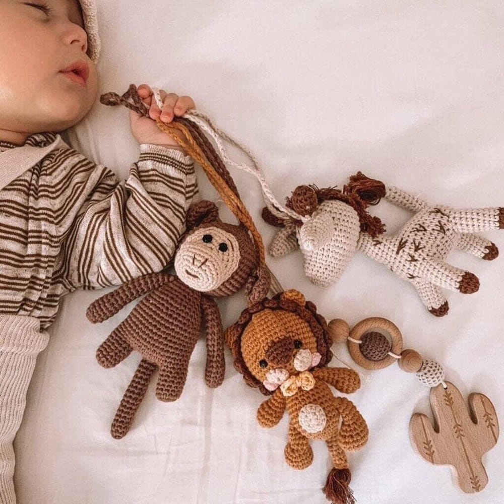 Handmade crochet toys for baby gym featuring Savanna Friends, perfect for stimulating play and development.