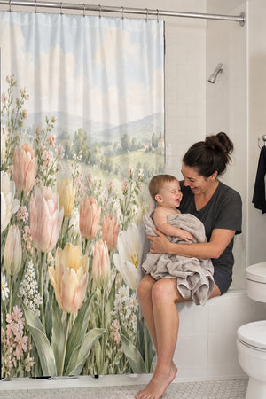 Mom holding her baby on the tub edge next to the Pastel Tulip Field shower curtain