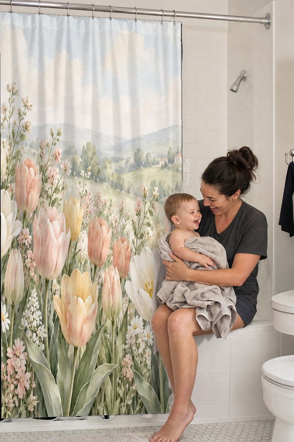Mom holding her baby on the tub edge next to the Pastel Tulip Field shower curtain