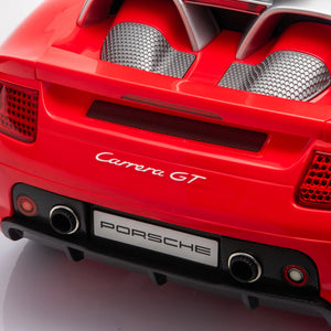 12V Porsche Carrera GT ride-on car for kids, angle view showcasing sleek design and vibrant colors.