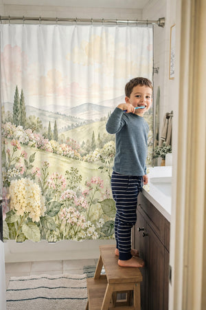Child brushing teeth in a family bathroom with the Hydrangea Garden shower curtain