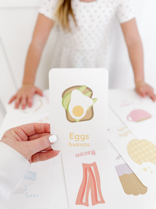 Colorful breakfast flashcards for babies, promoting early learning and sensory play, displayed at an angle.