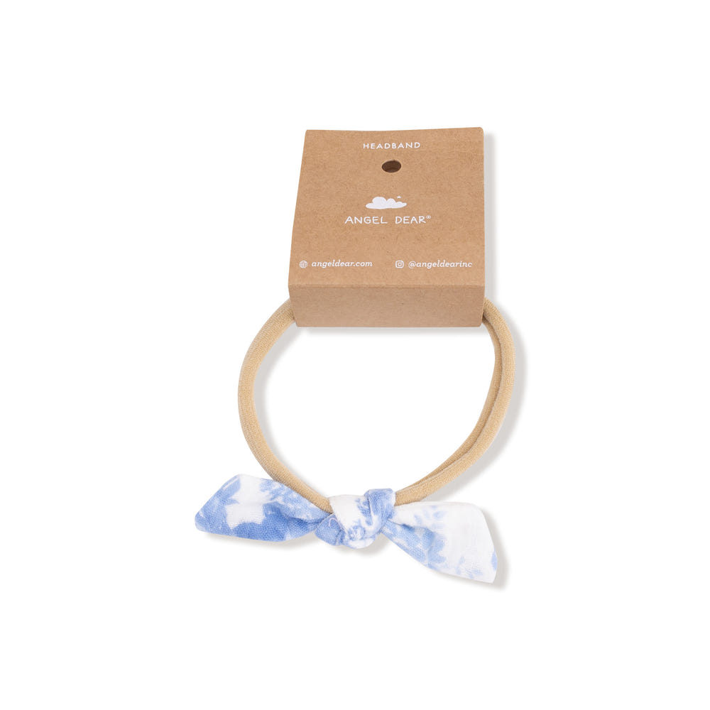 Dream Cottage Floral bow with nylon headband for babies, perfect accessory for any seasonal outfit.