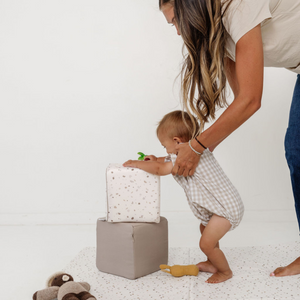 Terrazzo Chalk Play Cube from an angle, showcasing its vibrant design and playful features for babies.