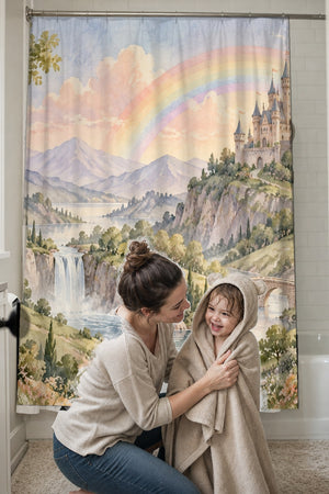 Mom drying her toddler in a hooded towel in front of the Rainbow Castle Fairy Tale shower curtain