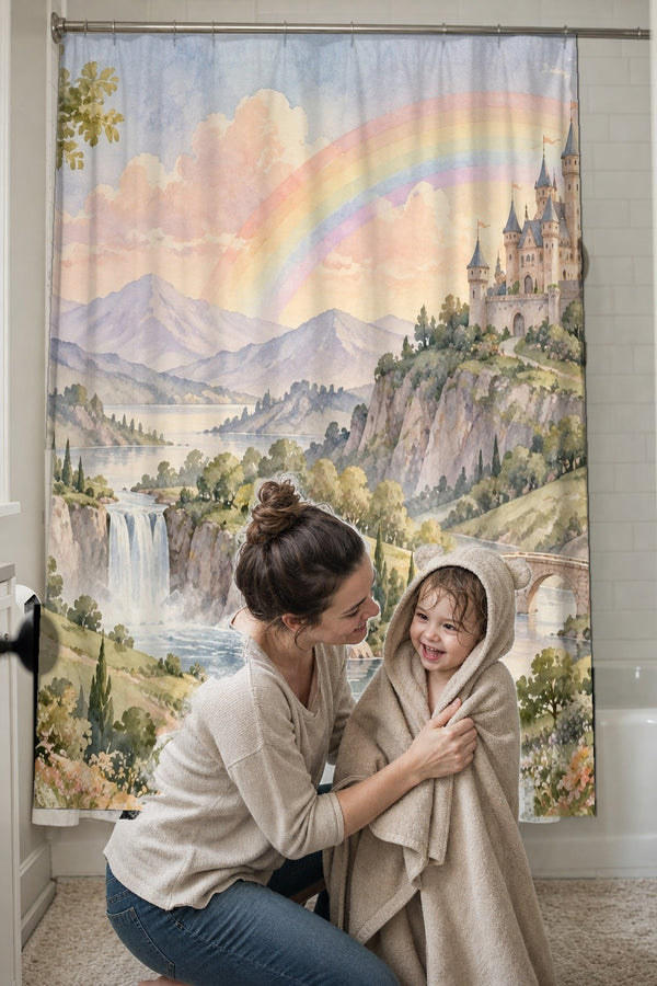 Mom drying her toddler in a hooded towel in front of the Rainbow Castle Fairy Tale shower curtain