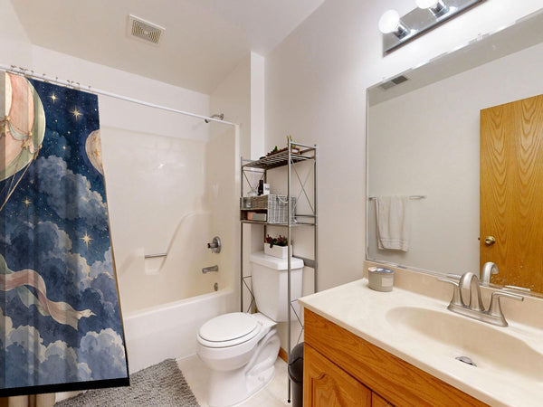 Moonlit Flight Hot Air Balloon shower curtain on a tub shower combo in an American family bathroom
