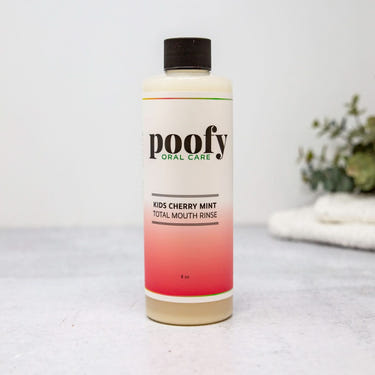 Kids Cherry Mint Total Mouth Rinse for kids' oral care, promoting fresh breath and healthy smiles.
