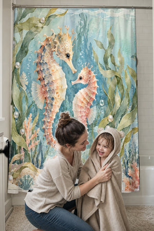 Mom drying her toddler in a hooded towel in front of the Seahorse Pair Ocean shower curtain