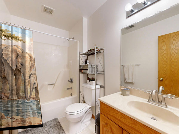 Elephant Family Safari shower curtain on a tub shower combo in an American family bathroom