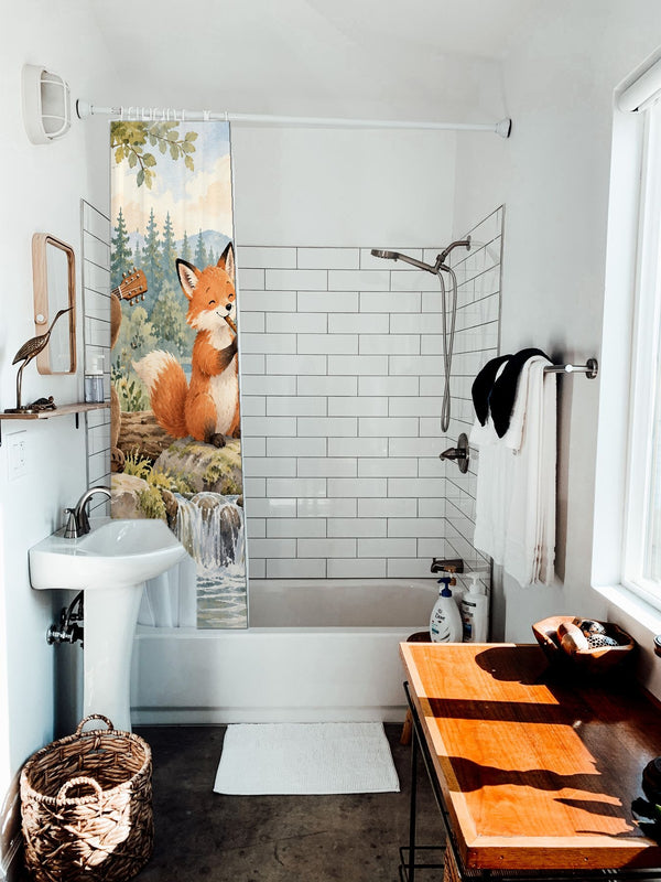 Woodland Band shower curtain hanging on the rod over a white bathtub