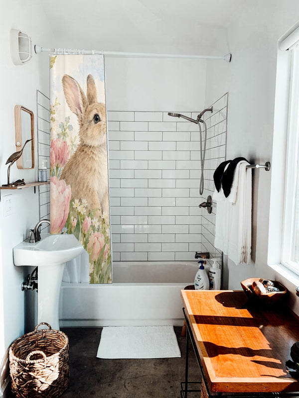 Spring Tulips Bunny shower curtain hanging on the rod over a white bathtub