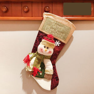 Christmas stocking featuring Santa and snowman decor, perfect for festive baby room decorations.