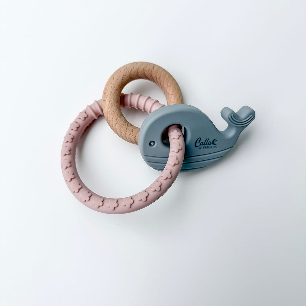 Whale silicone and beechwood teether for babies, perfect for soothing gums and teething relief.