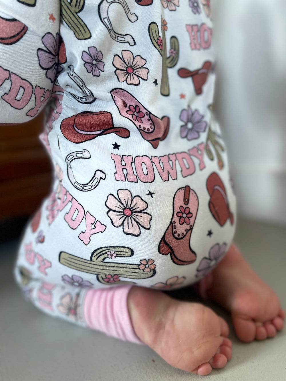 Howdy Darling Zippy: Cozy zip pajamas for babies, featuring soft fabric and adorable design for comfort and style.