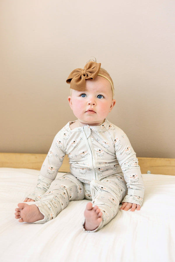 Polar Bear Zippy Romper for babies, cozy and cute, shown from angle 3. Perfect for playtime and snuggles.
