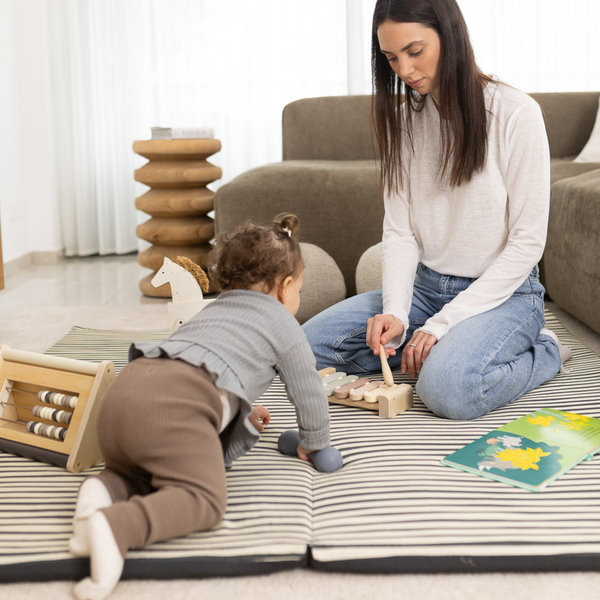 Bold Stripe Organic Cotton Mat for babies, showcasing vibrant colors and soft texture, perfect for playtime.