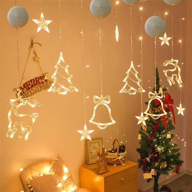 Christmas LED suction cup chandelier lights featuring Santa, elk, and snowman for festive window decor. Battery powered.