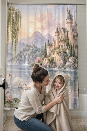 Mom drying her toddler in a hooded towel in front of the Lakeside Castle Fairy Tale shower curtain