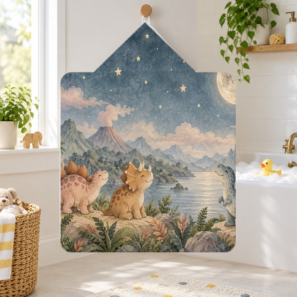 Moonlit Dinosaurs kids hooded bath towel hanging in a kids bathroom