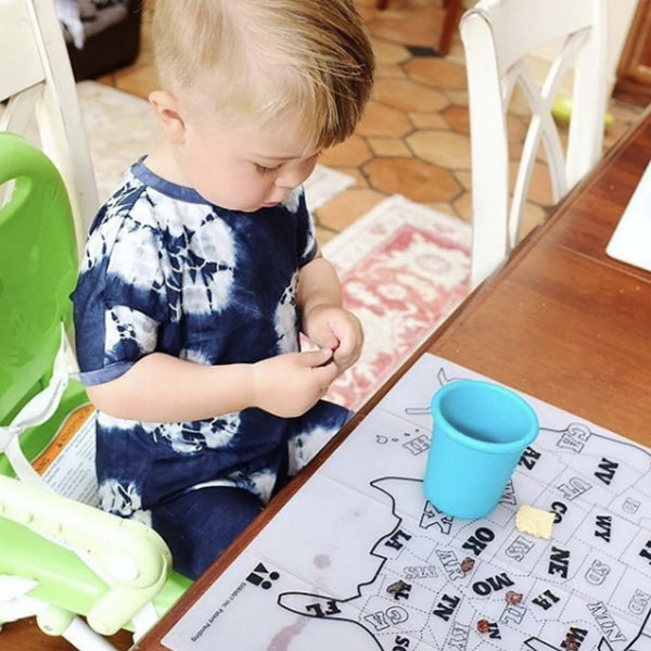 Colorful 8oz stackable silicone cups for kids and toddlers, 4-pack, displayed at an angle.