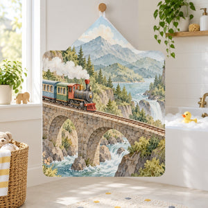 Tunnel Waterfall Train kids hooded bath towel hanging in a kids bathroom