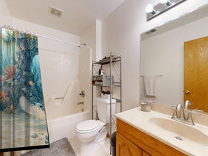 Treasure Cove Ocean shower curtain on a tub shower combo in an American family bathroom