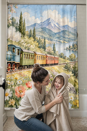 Mom drying her toddler in a hooded towel in front of the Flower Meadow Train shower curtain