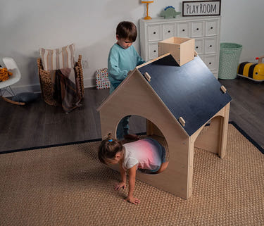 Evergreen children's indoor playhouse with a chalkboard roof, perfect for creative play and imagination.