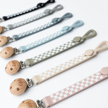 Nash Everything Clip in checkered design - stylish pacifier clip for babies.