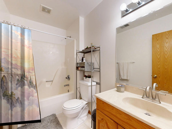 Cloud Towers Fairy Tale shower curtain on a tub shower combo in an American family bathroom