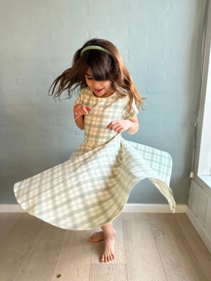 Sweetheart Twirl Dress in Fern Plaid, organic cotton jersey, perfect for baby swimwear, angle view 4.