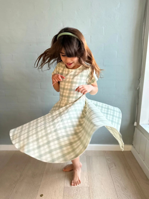 Sweetheart Twirl Dress in Fern Plaid, organic cotton jersey, perfect for baby swimwear, angle view 4.