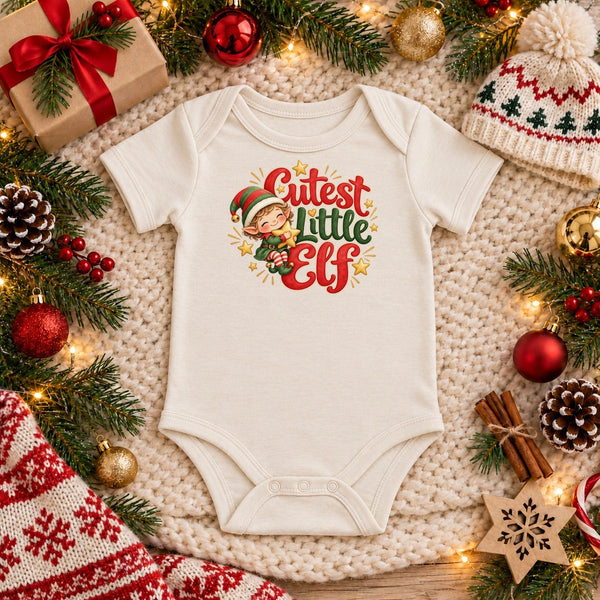 Cutest Little Elf organic cotton baby bodysuit in natural, Christmas flat lay