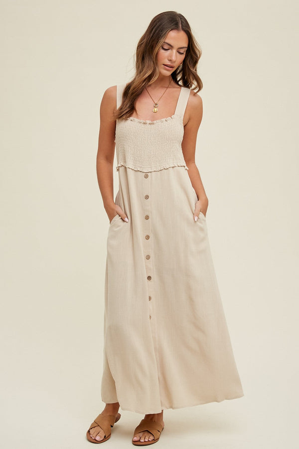 Beige button-down smocked maternity dress, stylish and comfortable for expecting mothers.