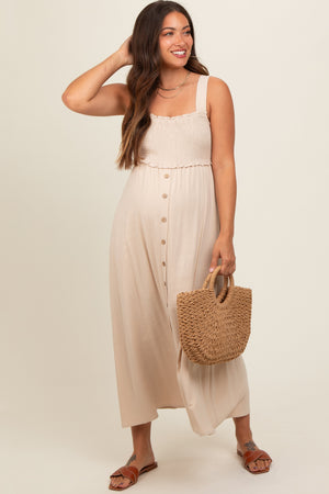 Beige button-down smocked maternity dress for stylish and comfortable pregnancy wear.