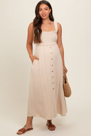 Beige button-down smocked maternity dress, stylish and comfortable for expecting mothers. Angle 2 view.