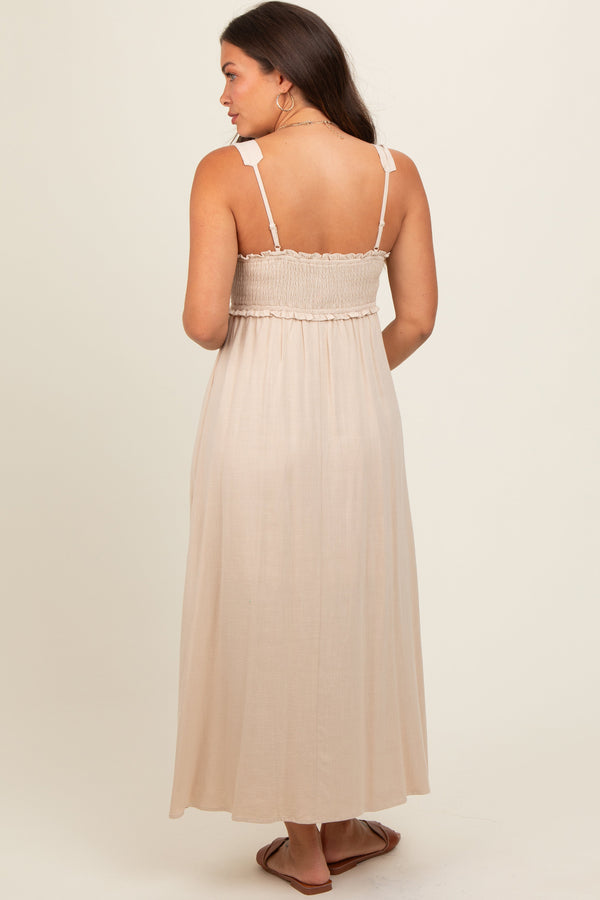 Beige button-down smocked maternity dress, stylish and comfortable for expecting mothers, shown from angle 4.
