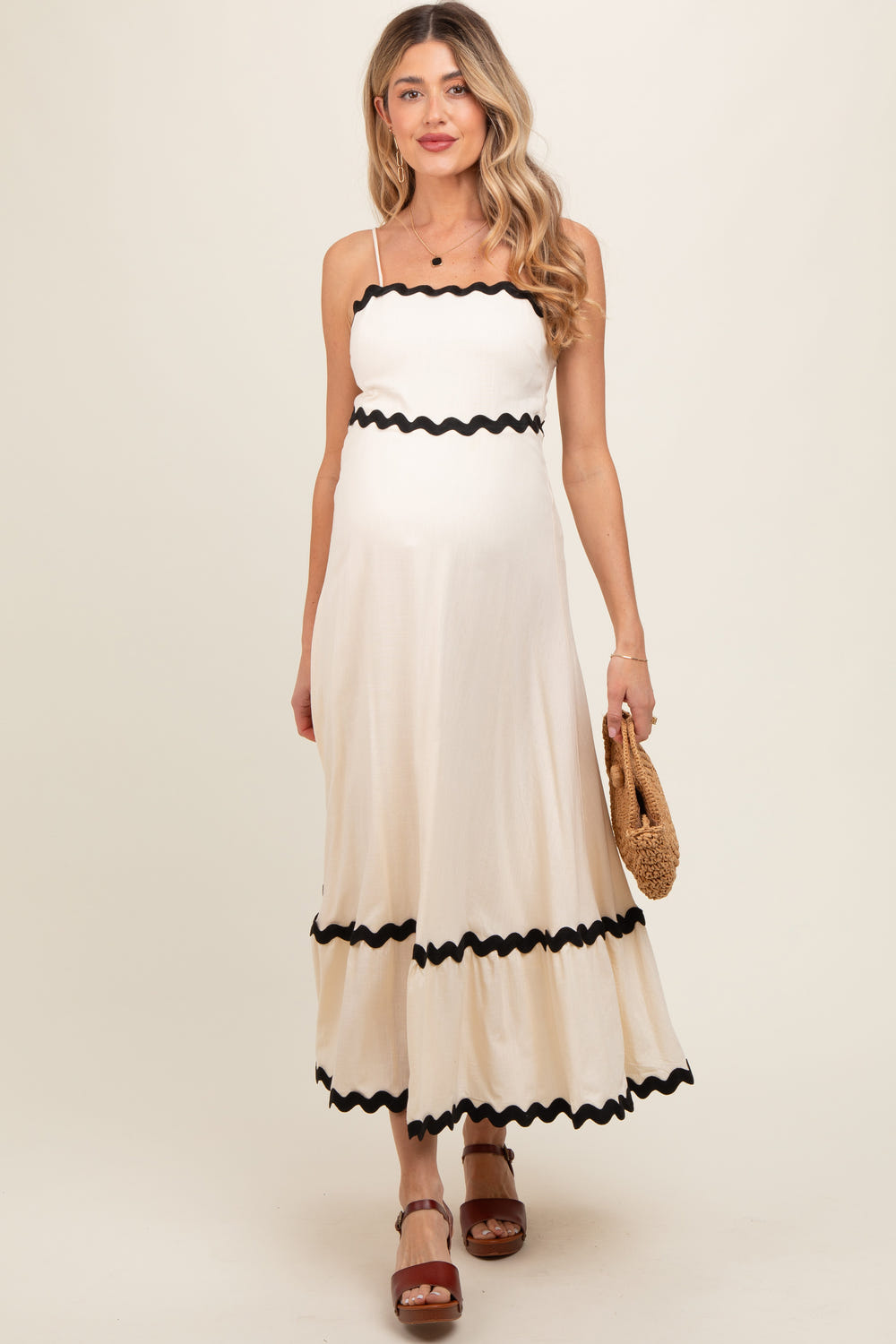 Beige colorblock trim maternity midi dress for stylish and comfortable wear during pregnancy.