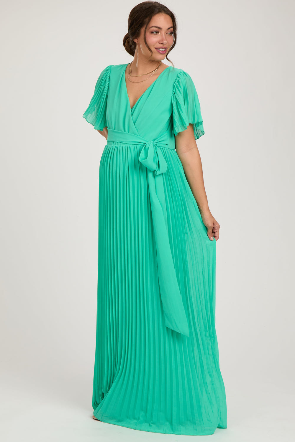 Aqua chiffon maternity maxi dress with pleated design and V-neck, perfect for stylish comfort during pregnancy.