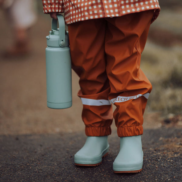 Sip + Chug 2 in 1 Thermo Water Bottle 24 oz in Fern color, angled view showcasing its sleek design and functionality.