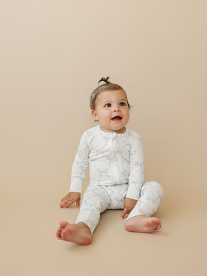 Blue Belle Ribbed Bamboo Zippy Pajamas for babies, featuring a cozy design and soft fabric in a stylish angle view.