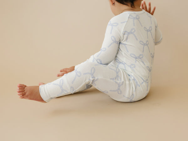 Blue Belle Ribbed Bamboo Zippy Pajamas for babies, cozy and stylish, shown from angle 8. Perfect for sleep and play.