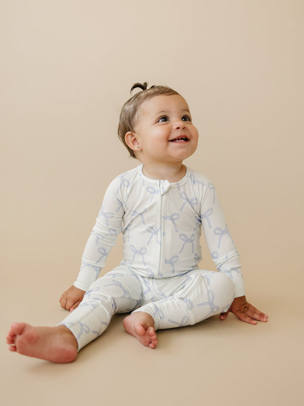 Blue Belle Ribbed Bamboo Zippy Pajamas for babies, cozy and stylish, shown at angle 12. Perfect for sleep and play.