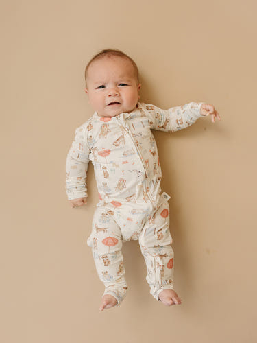 Baby Beach Pawty Bamboo Zippy Pajamas in vibrant colors, perfect for comfy beach days and playful adventures.
