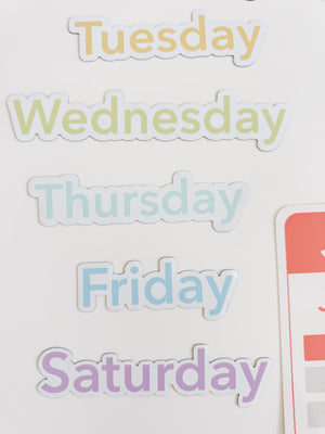 Colorful calendar flashcards and magnets for early learning, showcasing days, months, and seasons for sensory play.