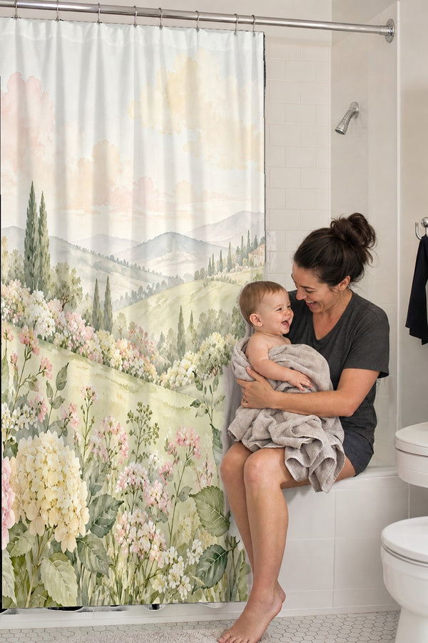 Mom holding her baby on the tub edge next to the Hydrangea Garden shower curtain