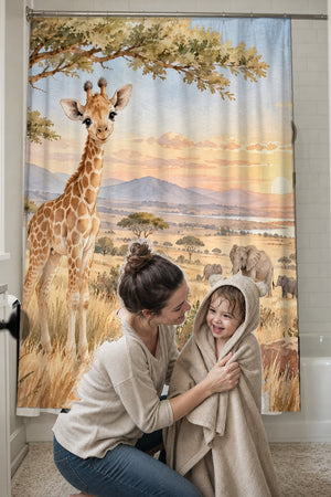 Mom drying her toddler in a hooded towel in front of the Baby Giraffe Safari shower curtain