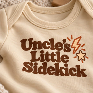 Close-up of the Uncle's Little Sidekick baby bodysuit print